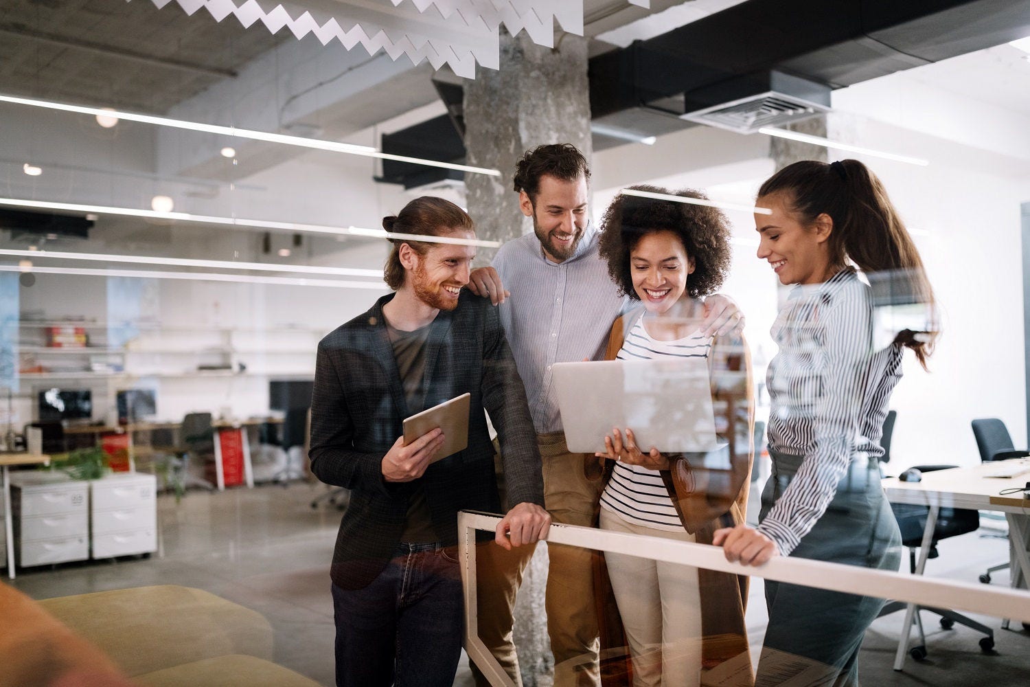 Group of young business people and designers.They working on new project.Startup concept. Young business people and designers.They working on new project.Startup concept.