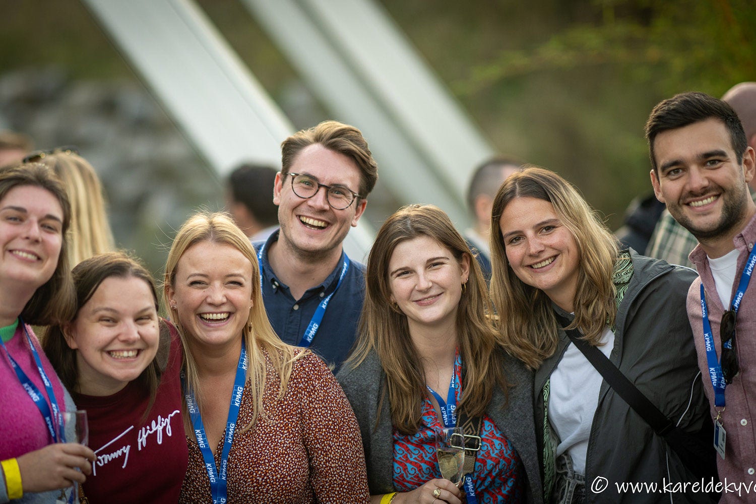 A group of people posing for the picture in close-up.