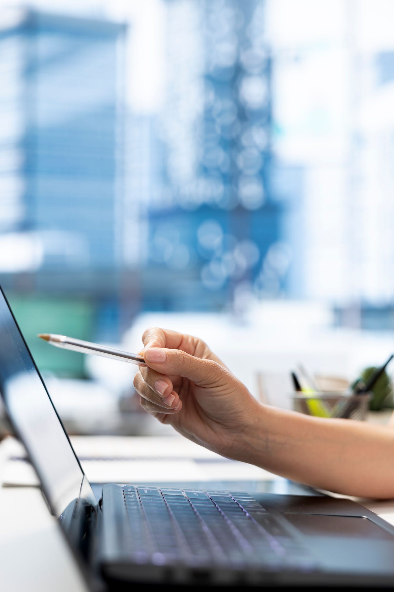 HR department worker using laptop to do background checks for potential job applicants. Close up of employer using notebook to implement recruiting strategies to attract qualified candidates