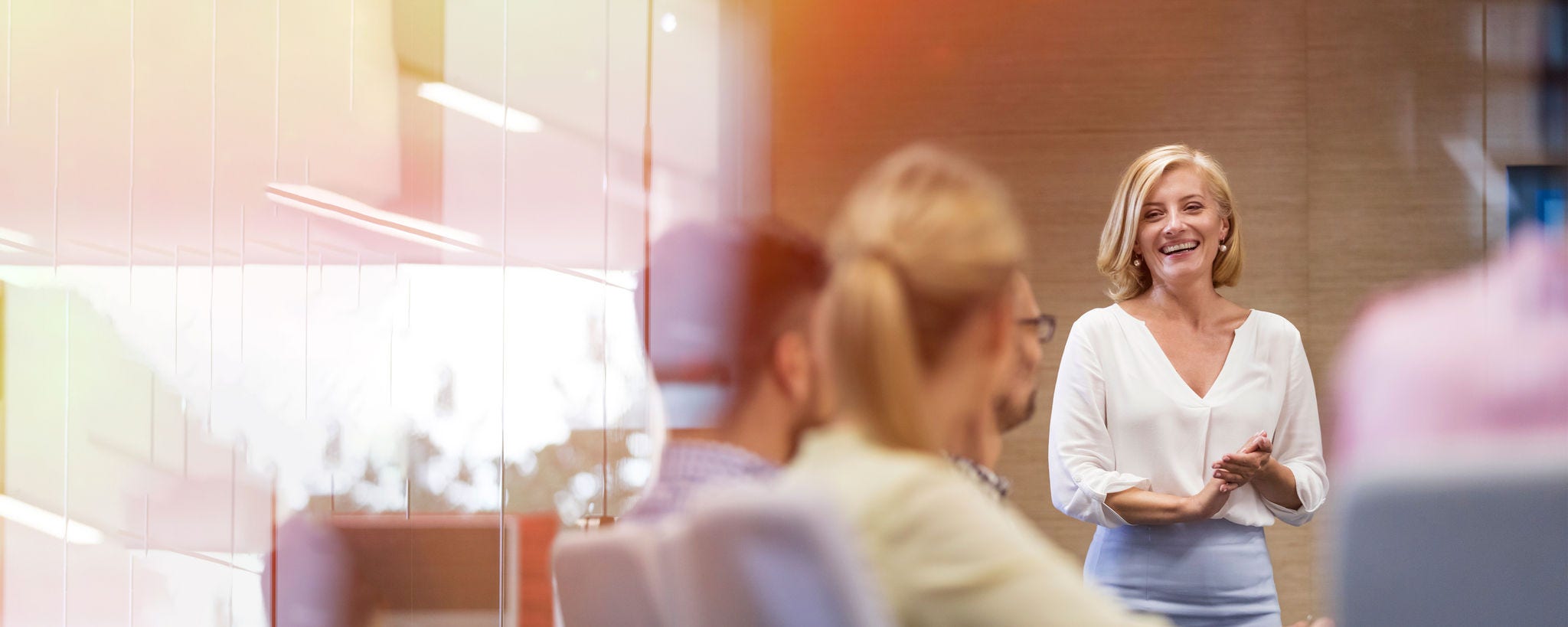 Smiling businesswoman leading a meeting in a conference room Bridge tunnel