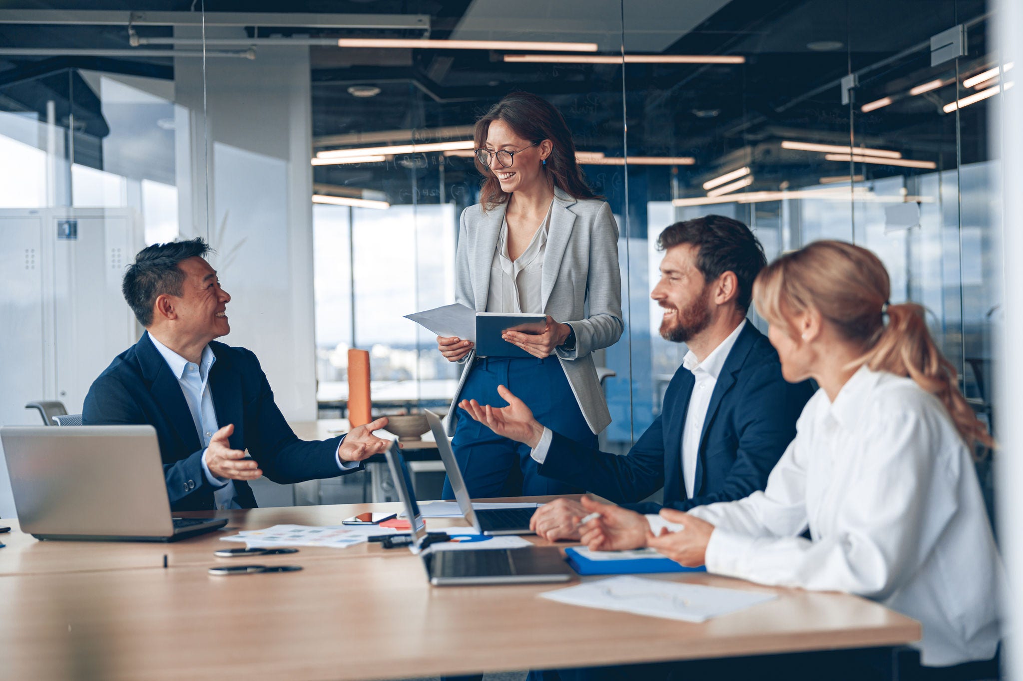 A group of business people partners during a set team meeting in the modern office A group of business people partners during a set team meeting in the modern office.High quality