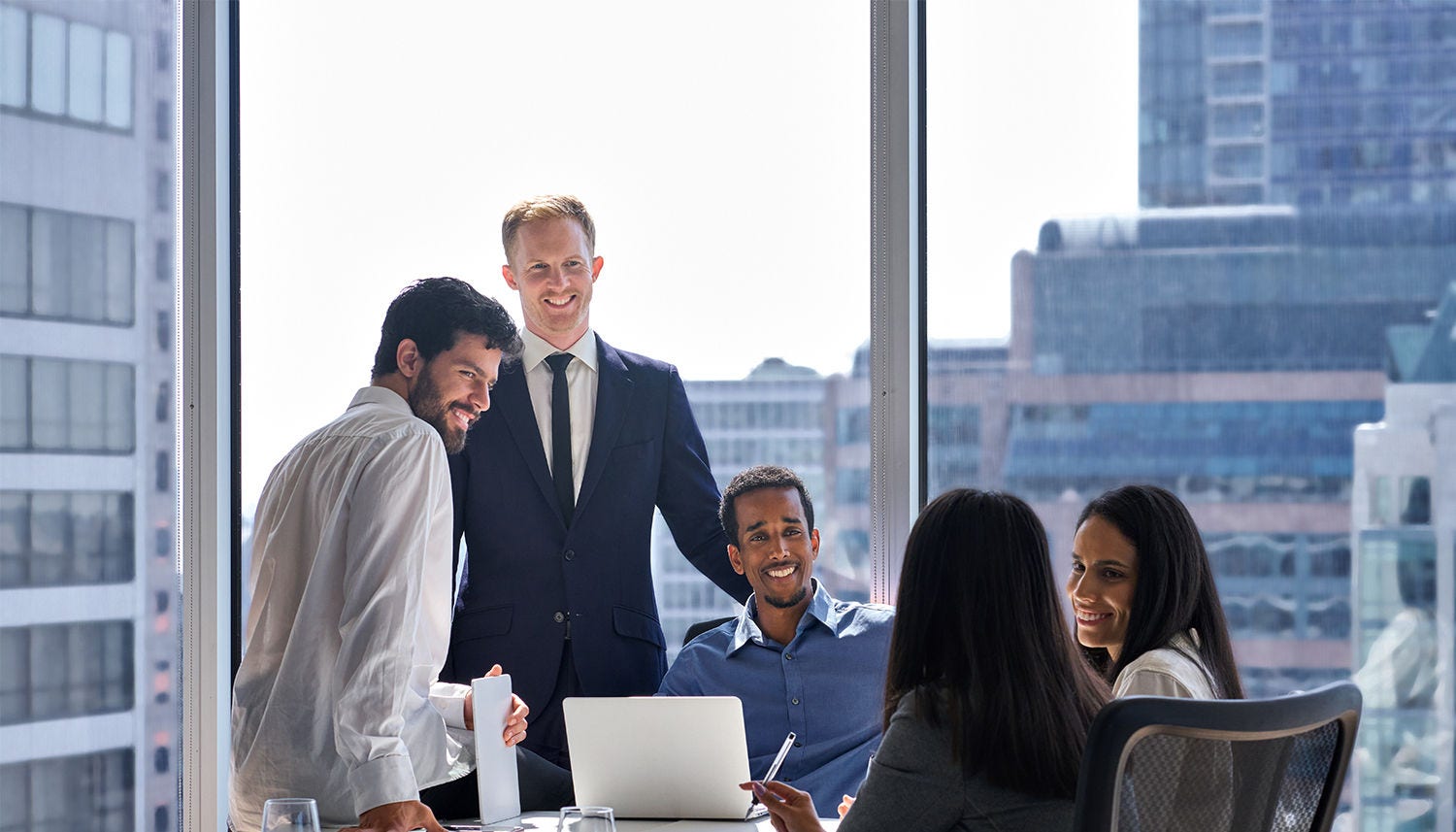 Professional happy diverse team business people talking at office meeting.