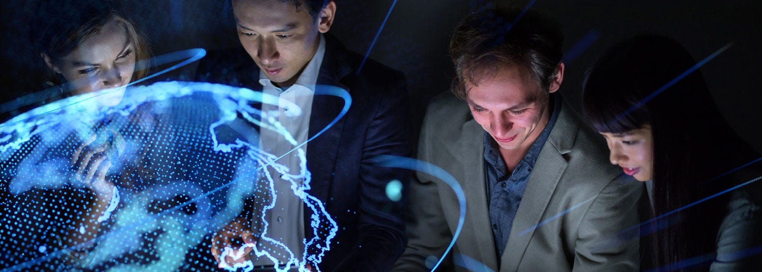 Tax consultants looking at digital model of the globe