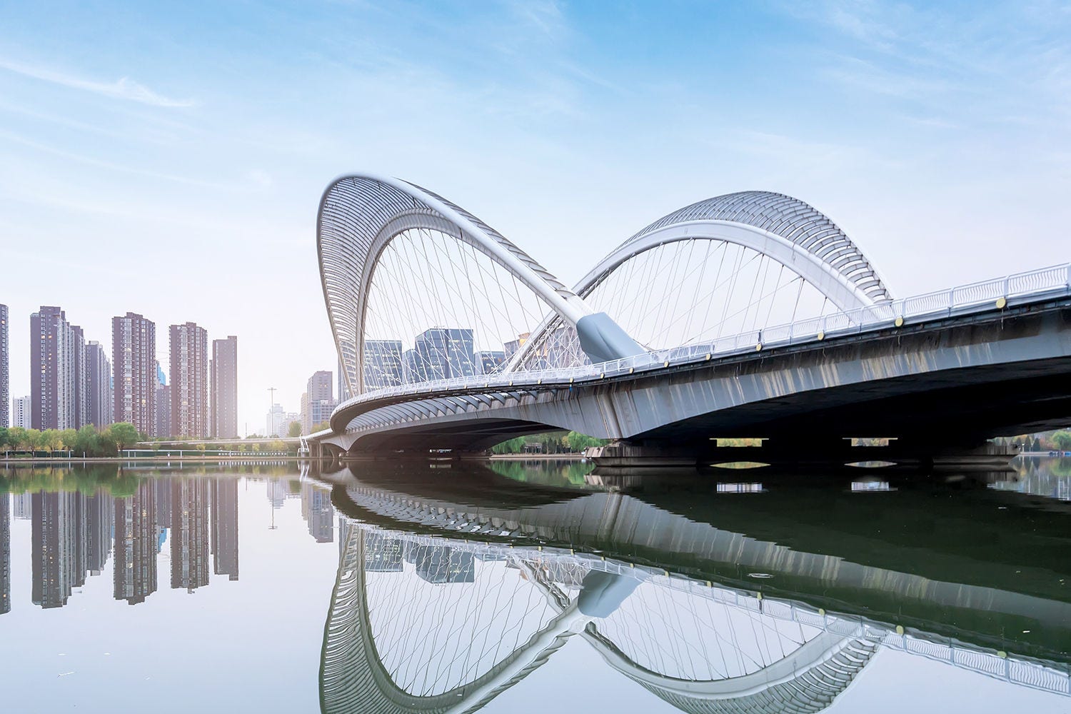 Skyline against a river and a bridge