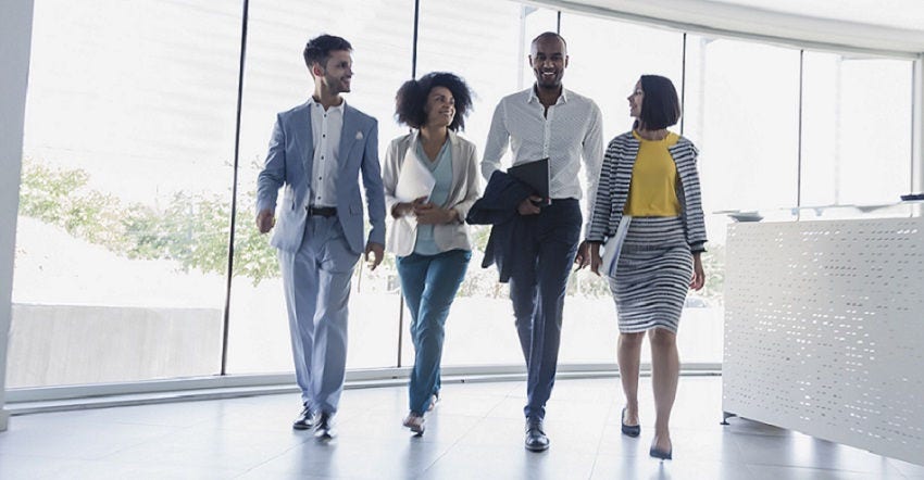 four-colleagues-walking-and-talking