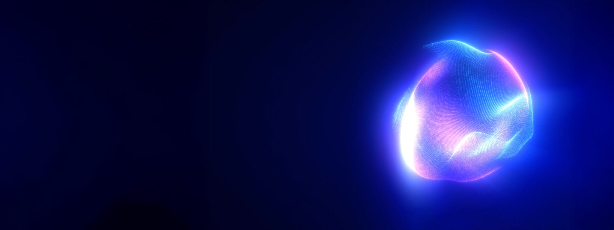 Glowing bright light orb Glowing bright light orb against a dark background