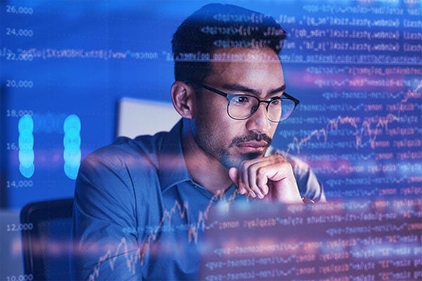 man looking at computer