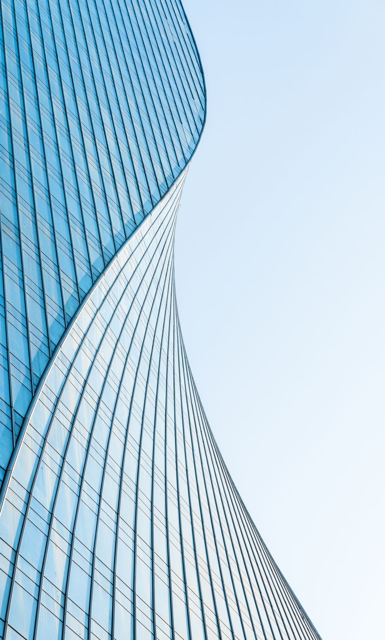close up view of unknown modern building exterior and glass windows.