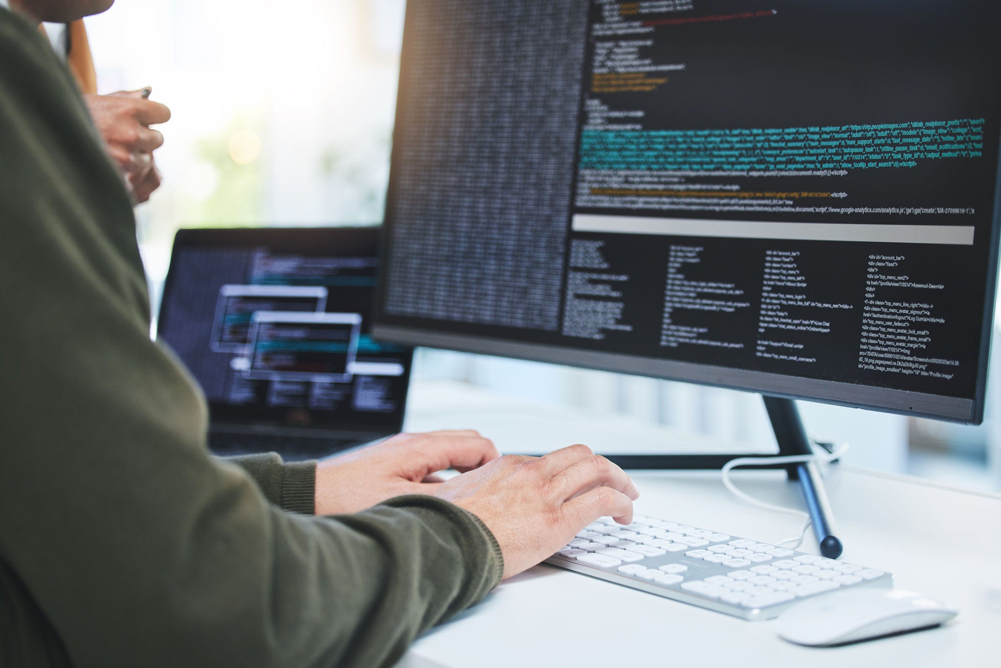 Programming, developer and hands on computer for coding, software script or cyber security in office. Closeup of IT technician person with technology for typing code, future and data analytics.