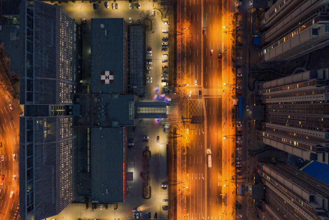 Overhead view of a hospital and ambulances in the driveway Overhead view of a hospital and ambulances in the driveway
