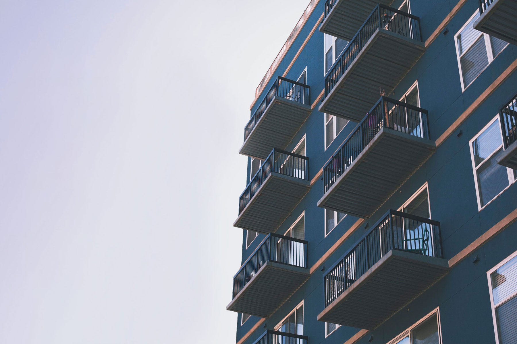 dark blue building with several apartments