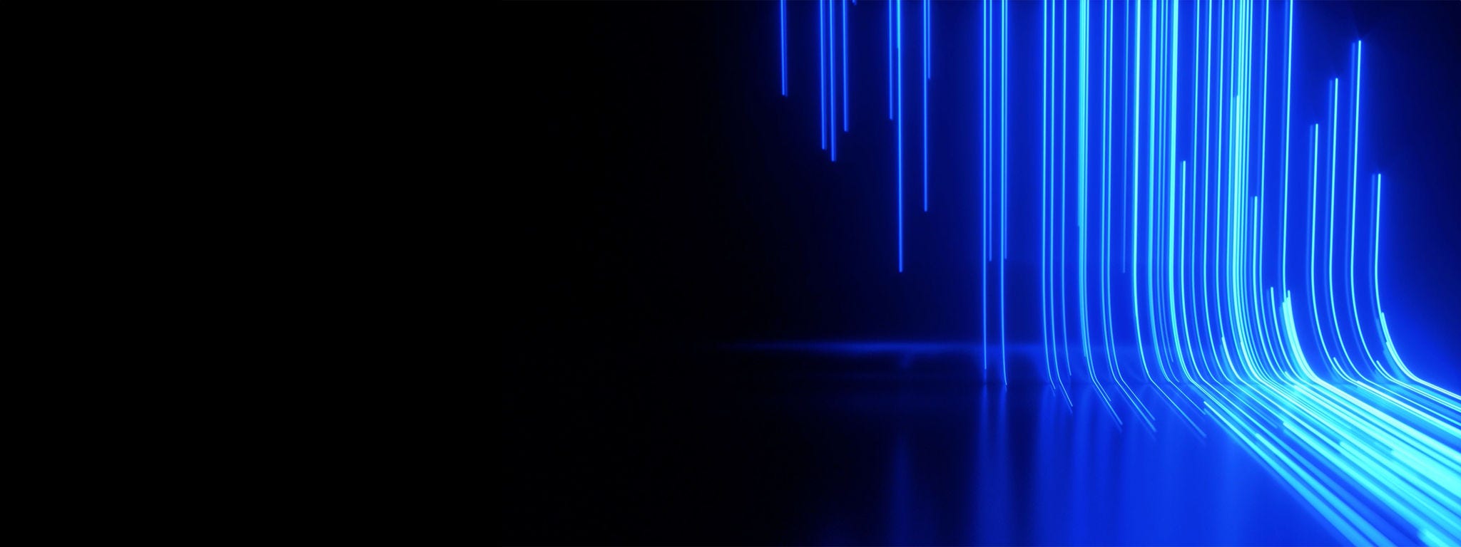 Bending streaks of neon cobalt light Bending streaks of neon cobalt light against a dark background