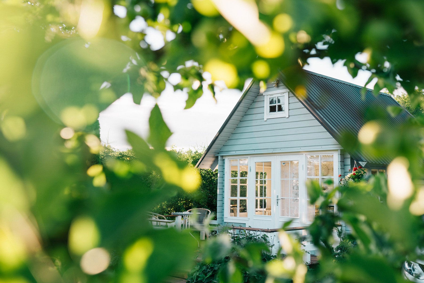 light blue house with garden