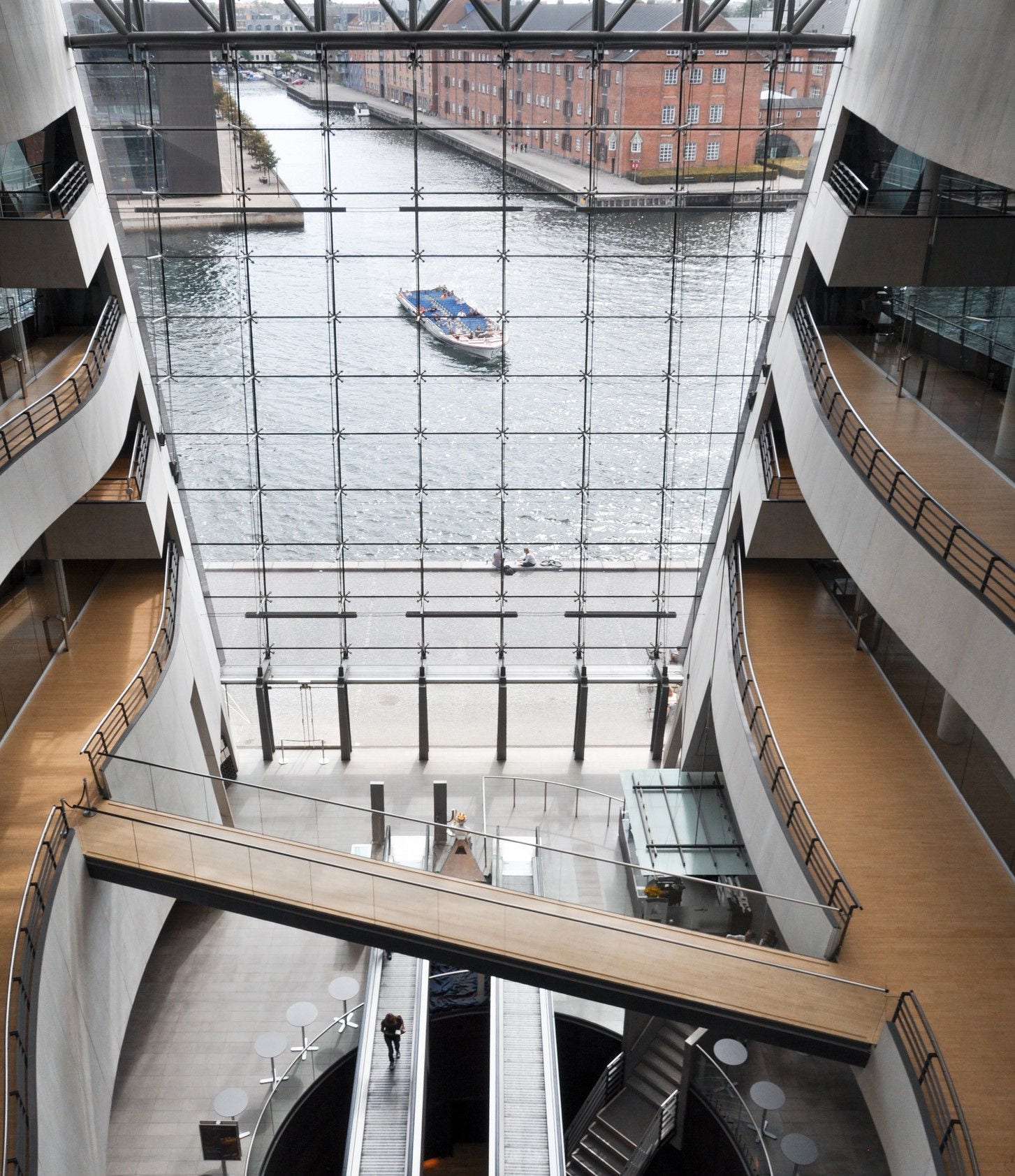 Interior of the Royal National Library. Huge glass wall with panoramic view of the harbor. Copenhagen, Denmark - August 21 2010.