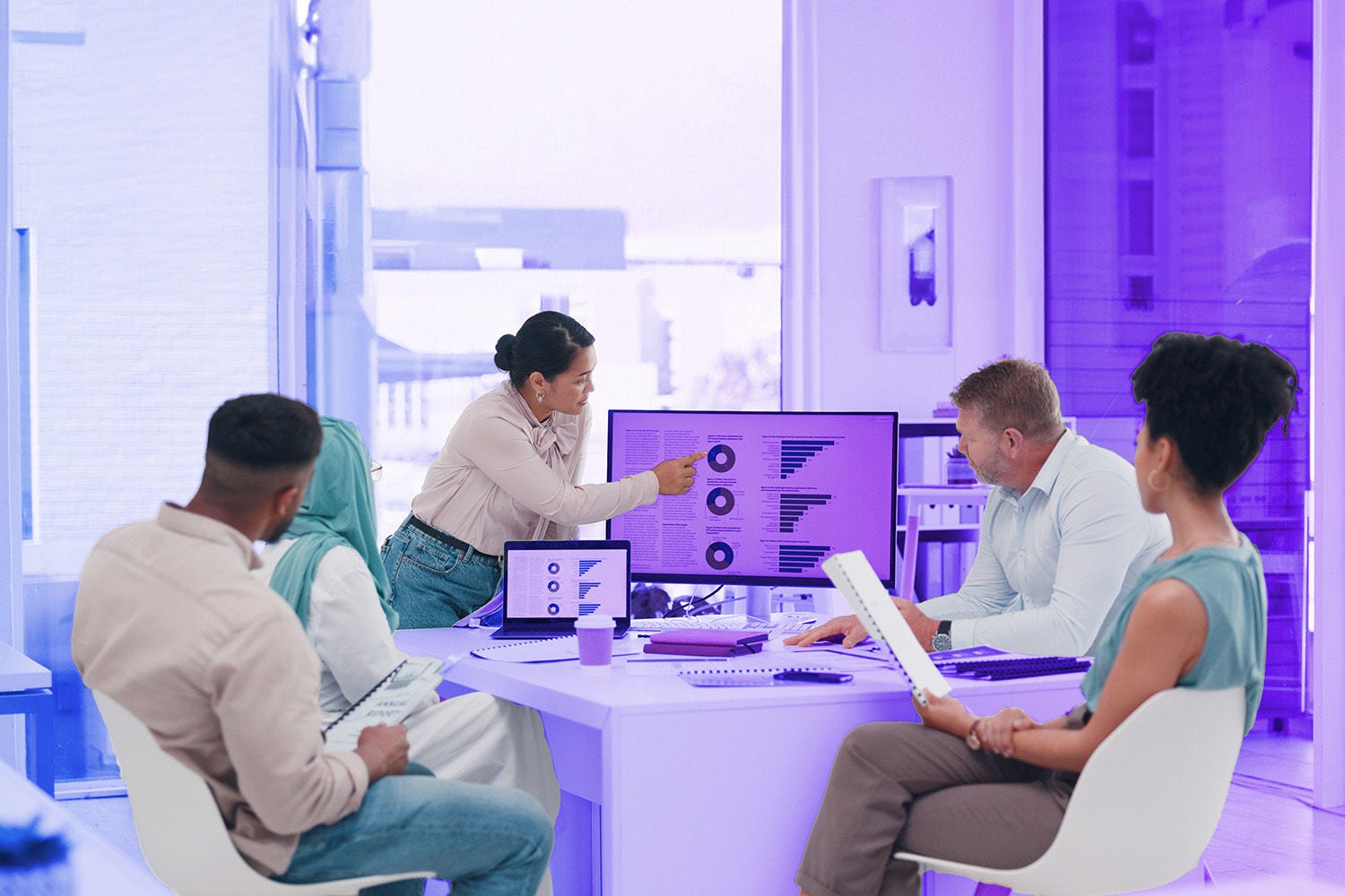 Business group looking at computer