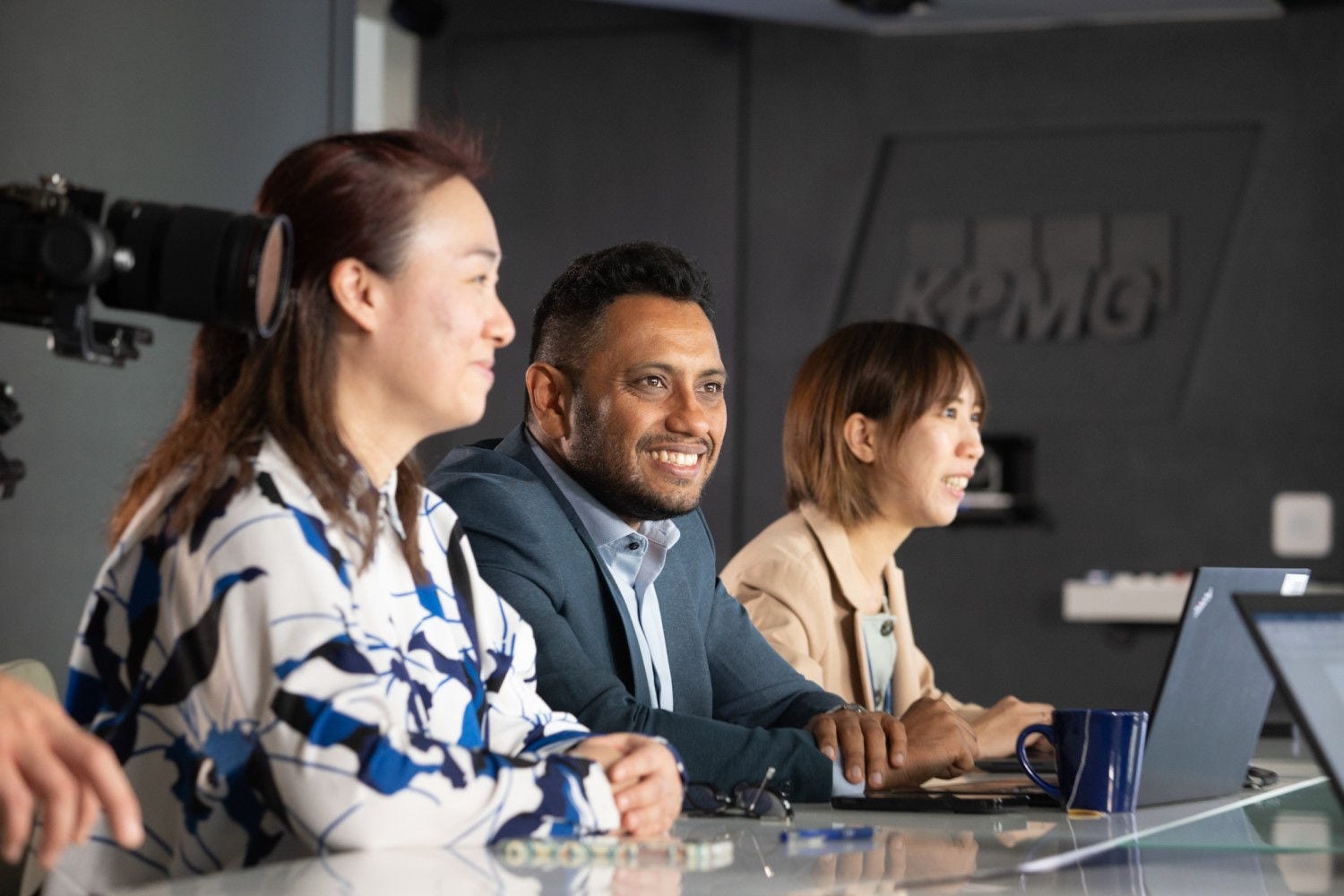 Three people in KPMG office