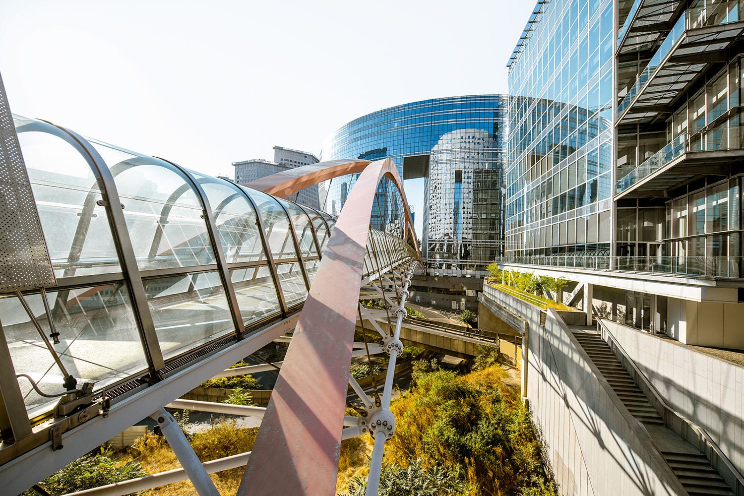 Glass bridge at front of glass building