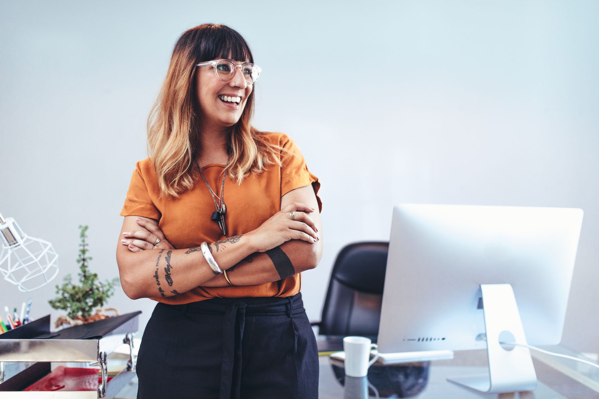 Close up of a business woman in office woman posing by computer