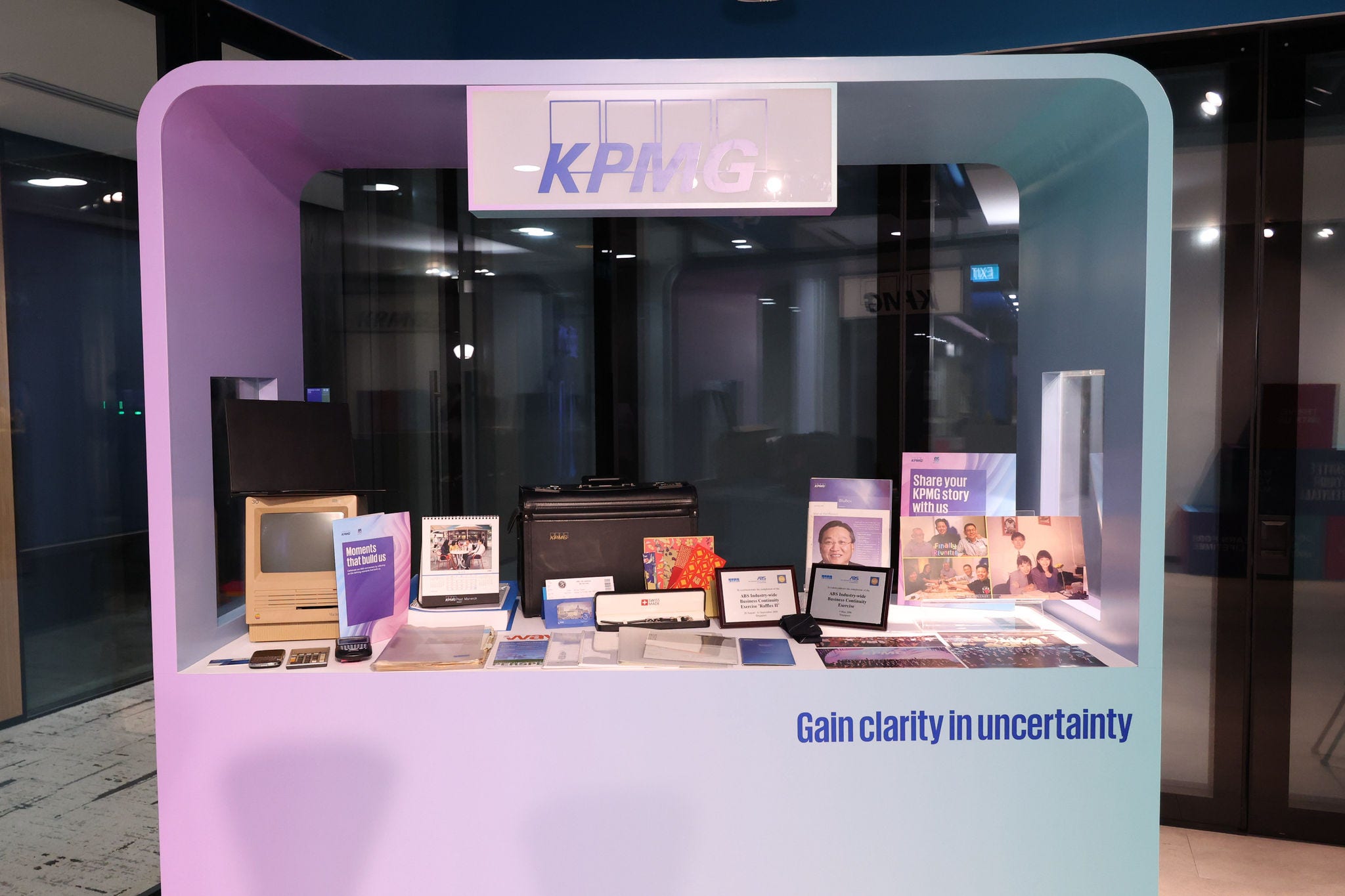 Partners Reunion Dinner 2026 - booth displaying KPMG memorabilia from the past