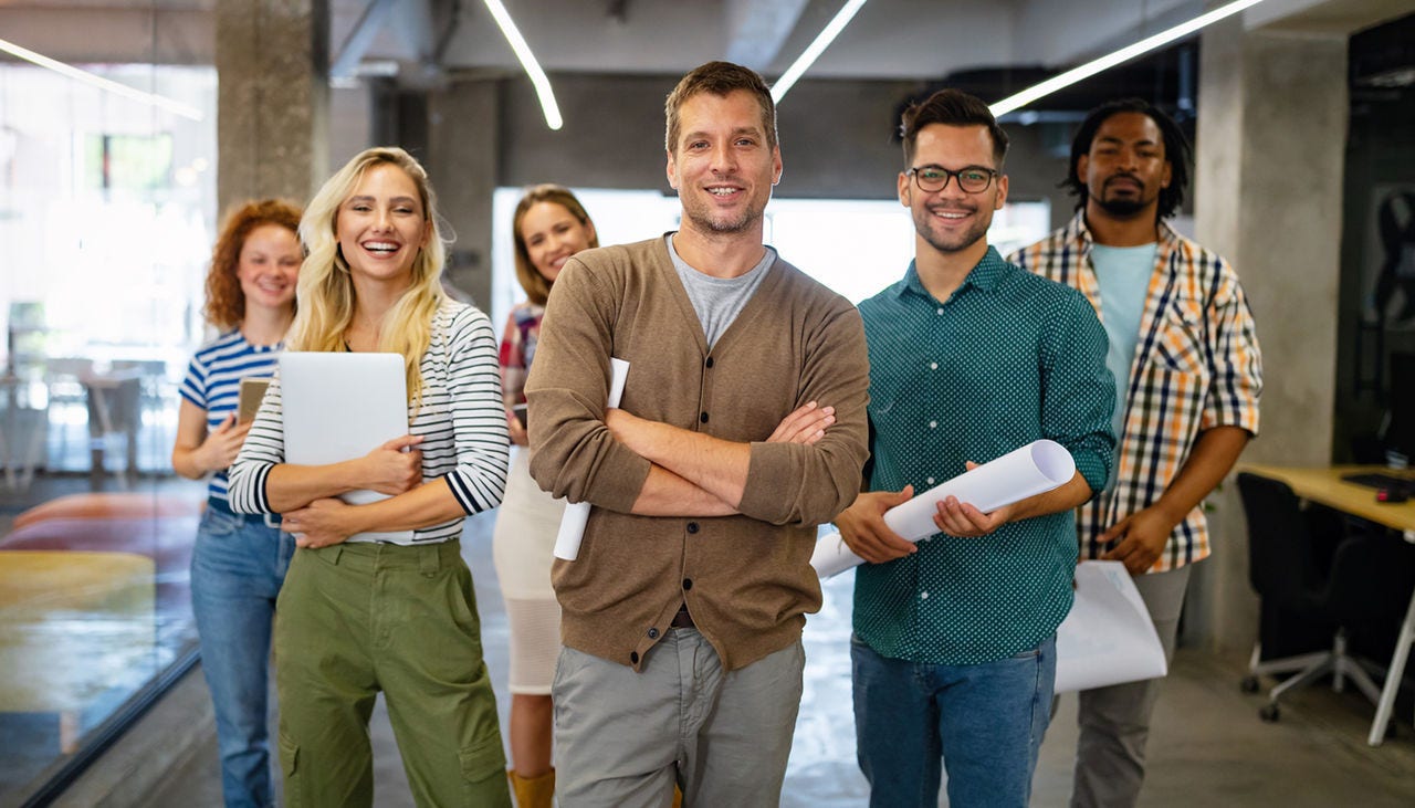 Group of successful business people designers architects in office Group of successful business people designers architects in office