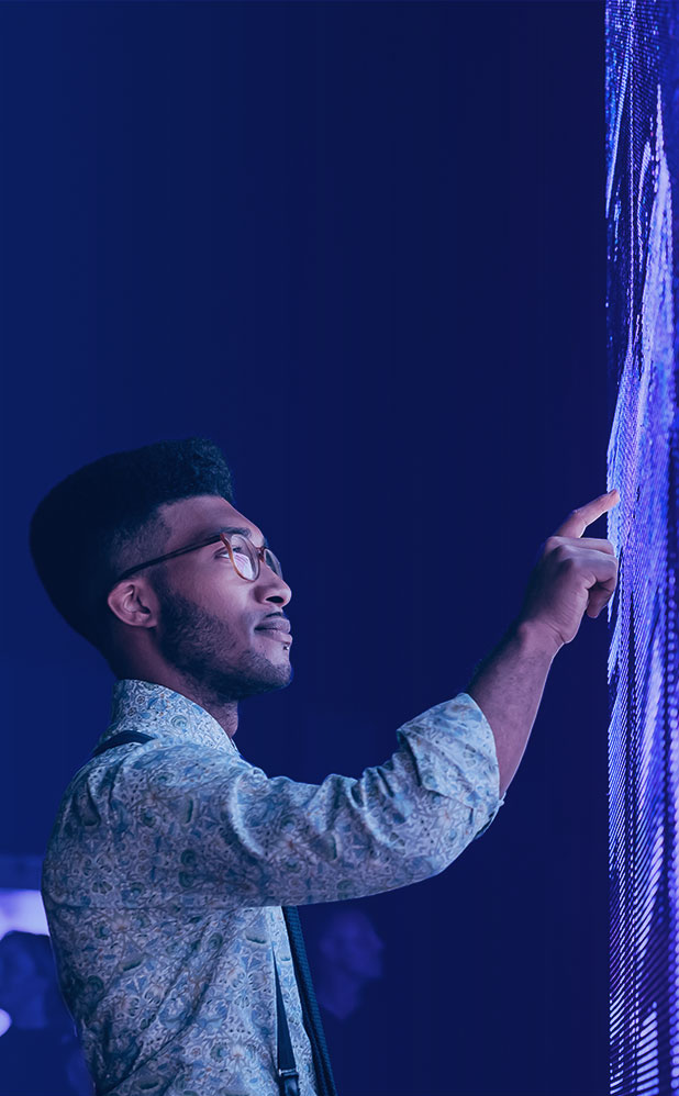 man working on a big screen