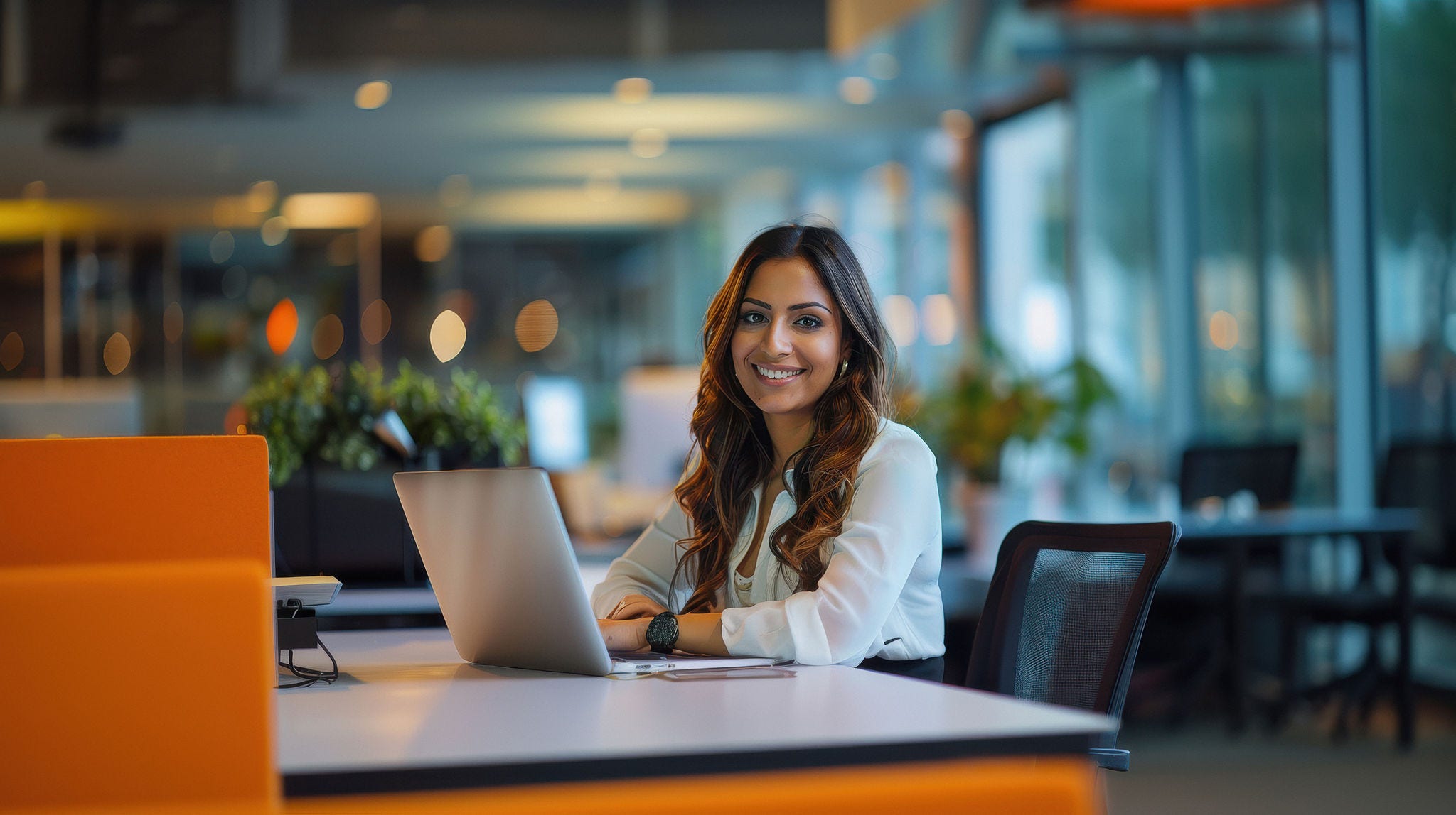 young indian woman working on laptop