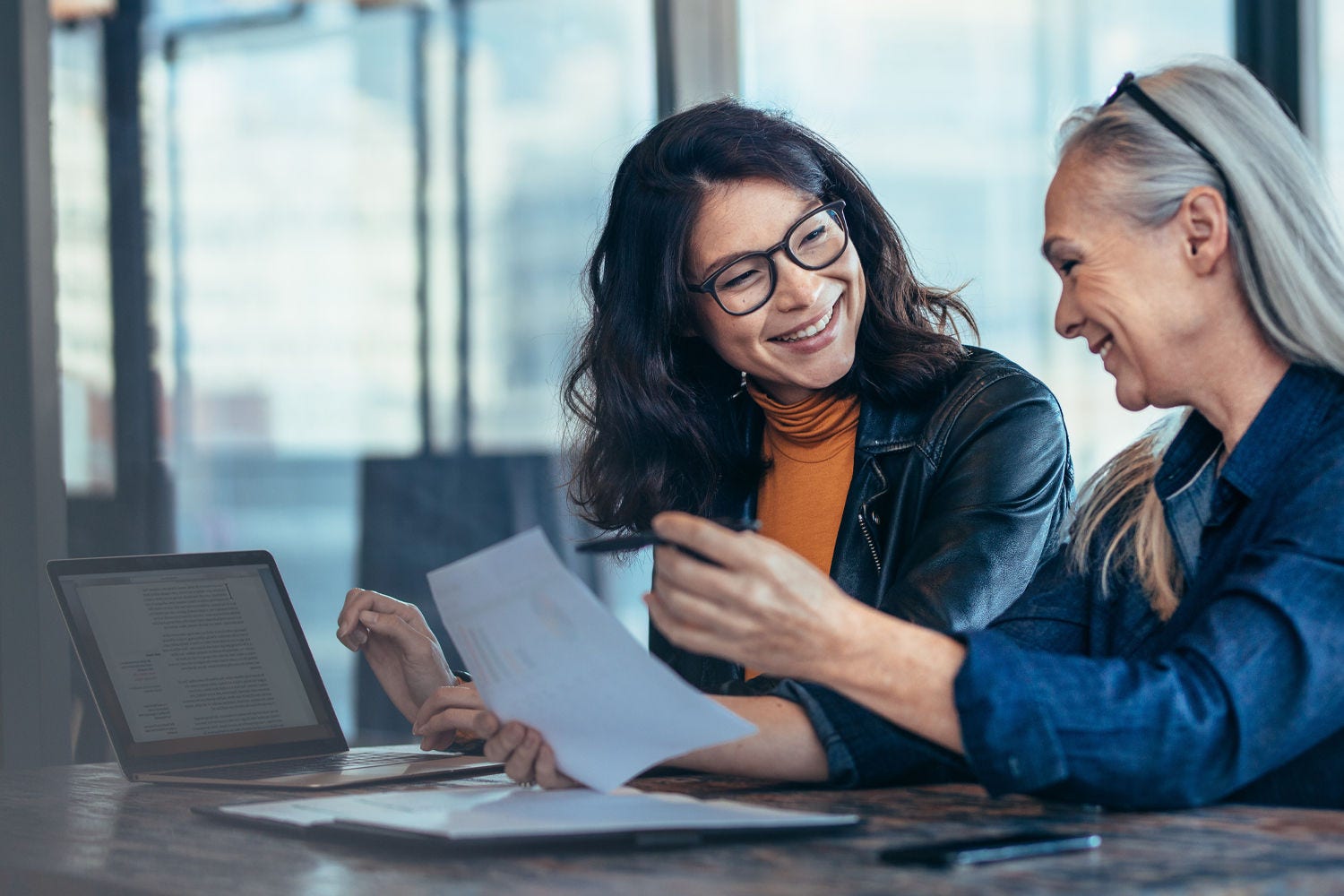 Two woman working and smiling