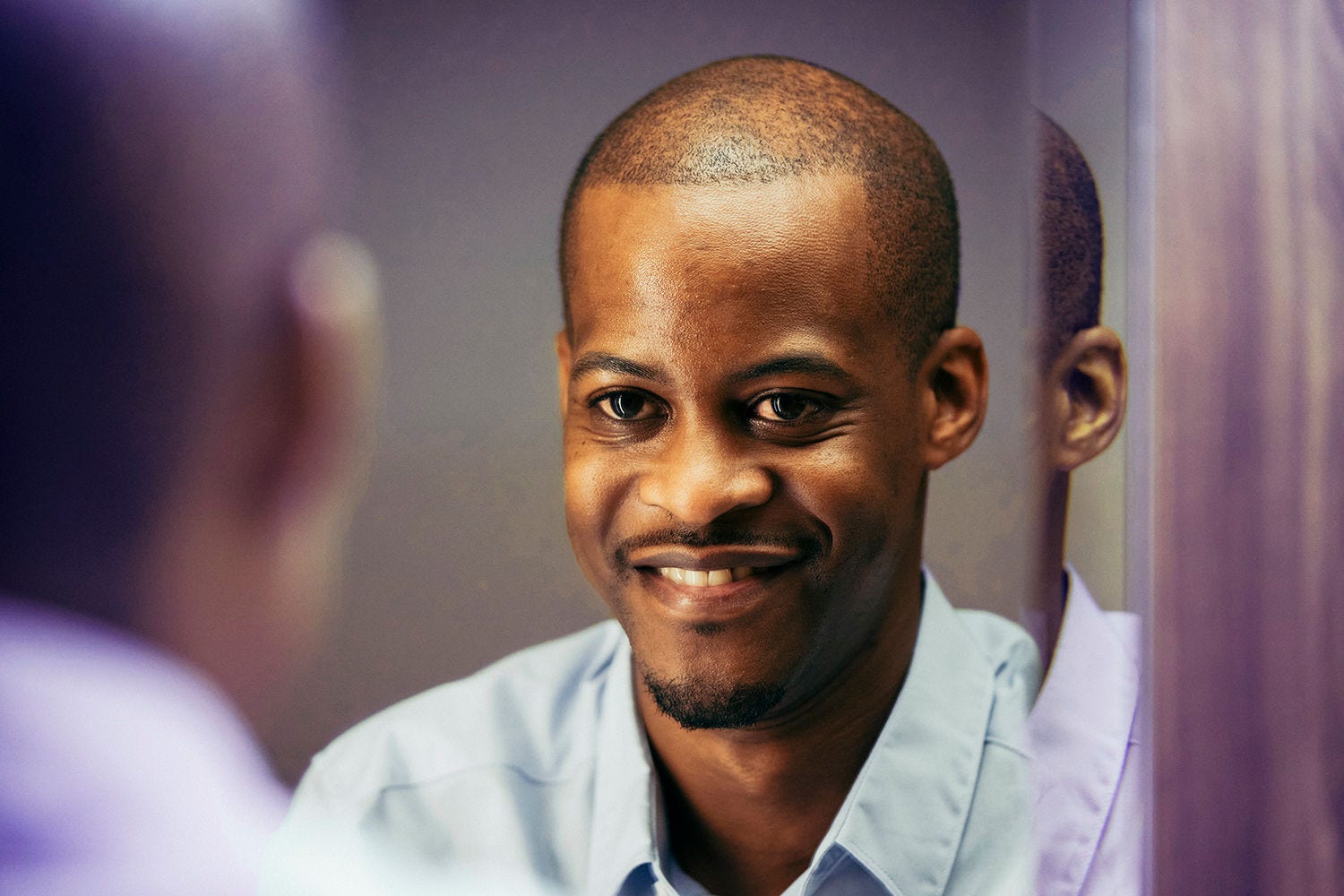 Man looking in the mirror