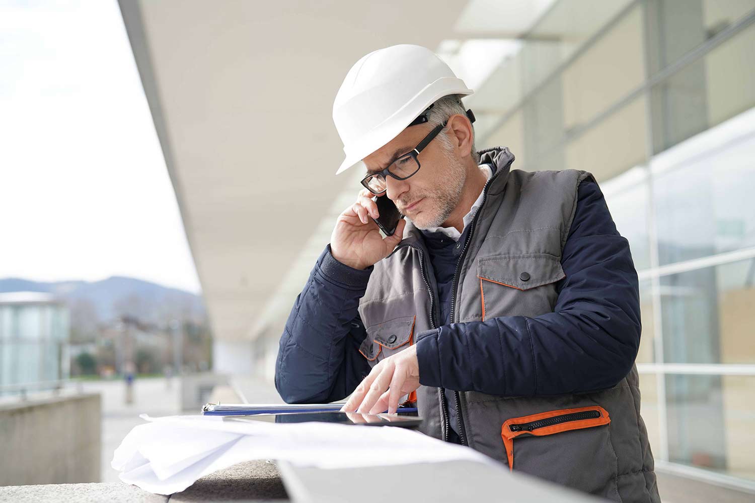 Engineer looking at project plans representing project management