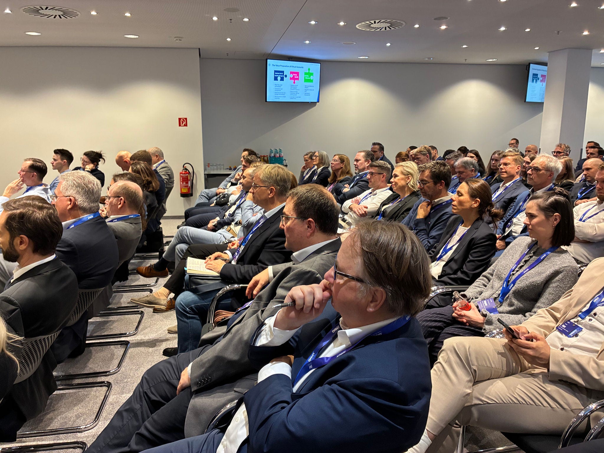 Audience members in the conference area at KPMG Frankfurt