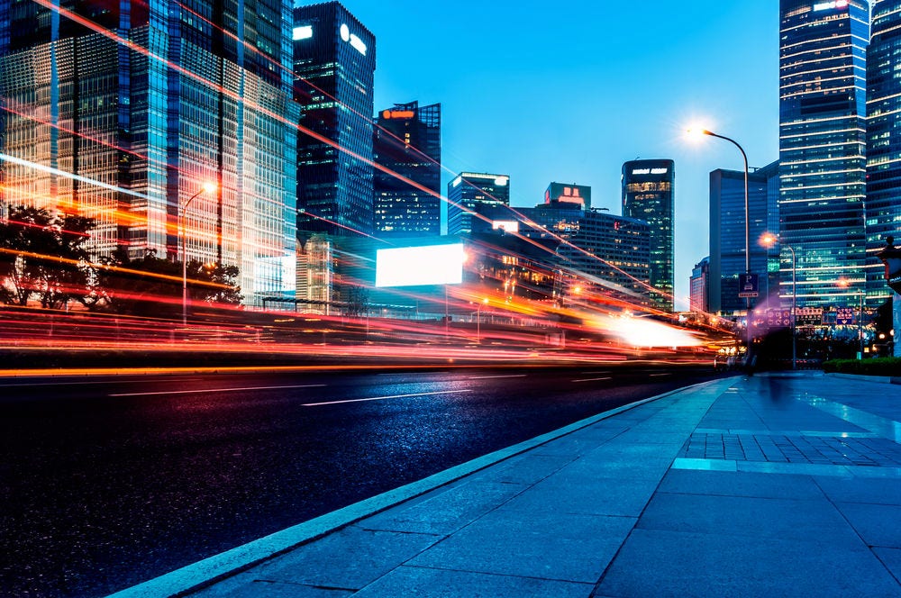 146384984 The light trails on the modern building background in shanghai china.; Shutterstock ID 146384984; PO: Tax Reform
