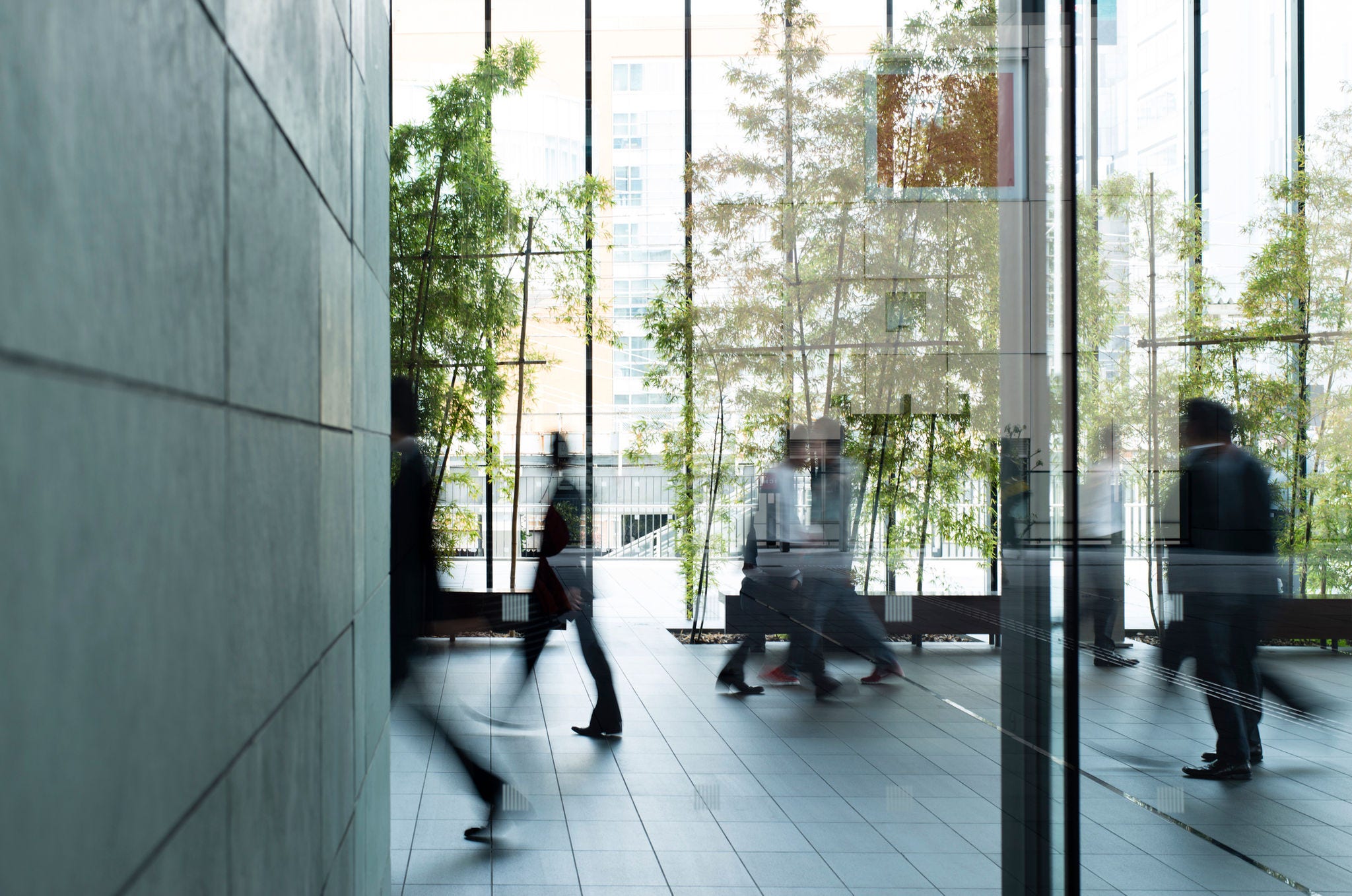 488888801 Business person walking in a urban building