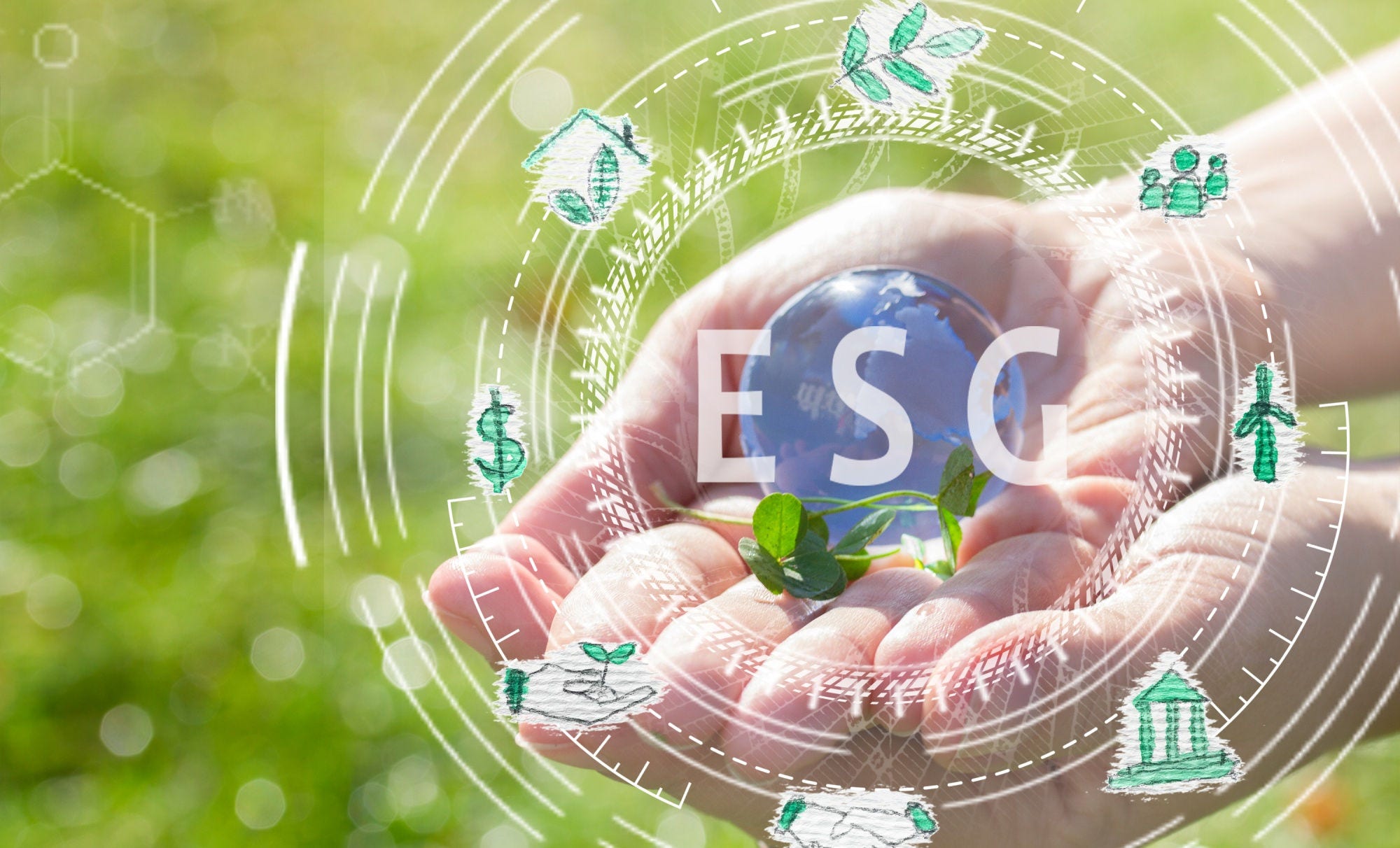 Glass globe in hand on grass background concept for environment, toned
