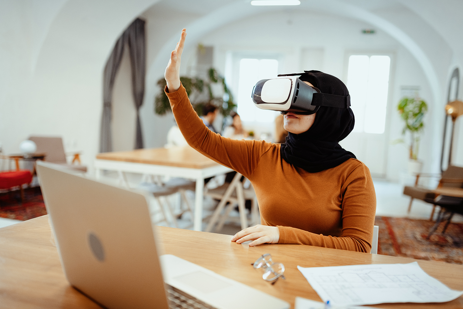 coworkers at a table discussing something