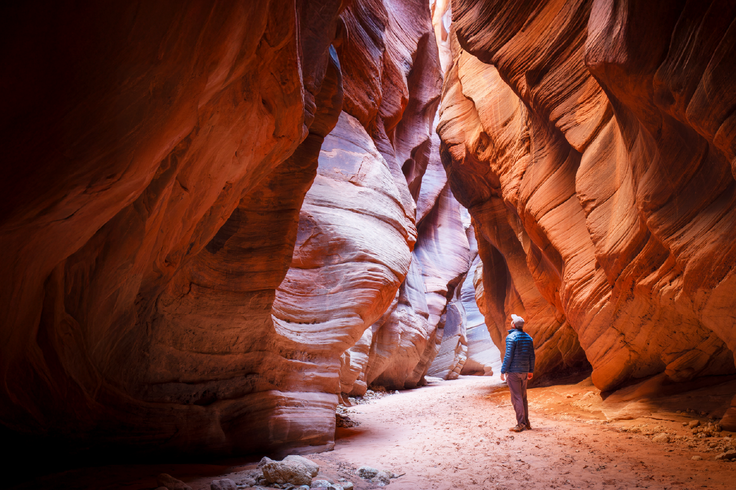 students at a table with laptops and books