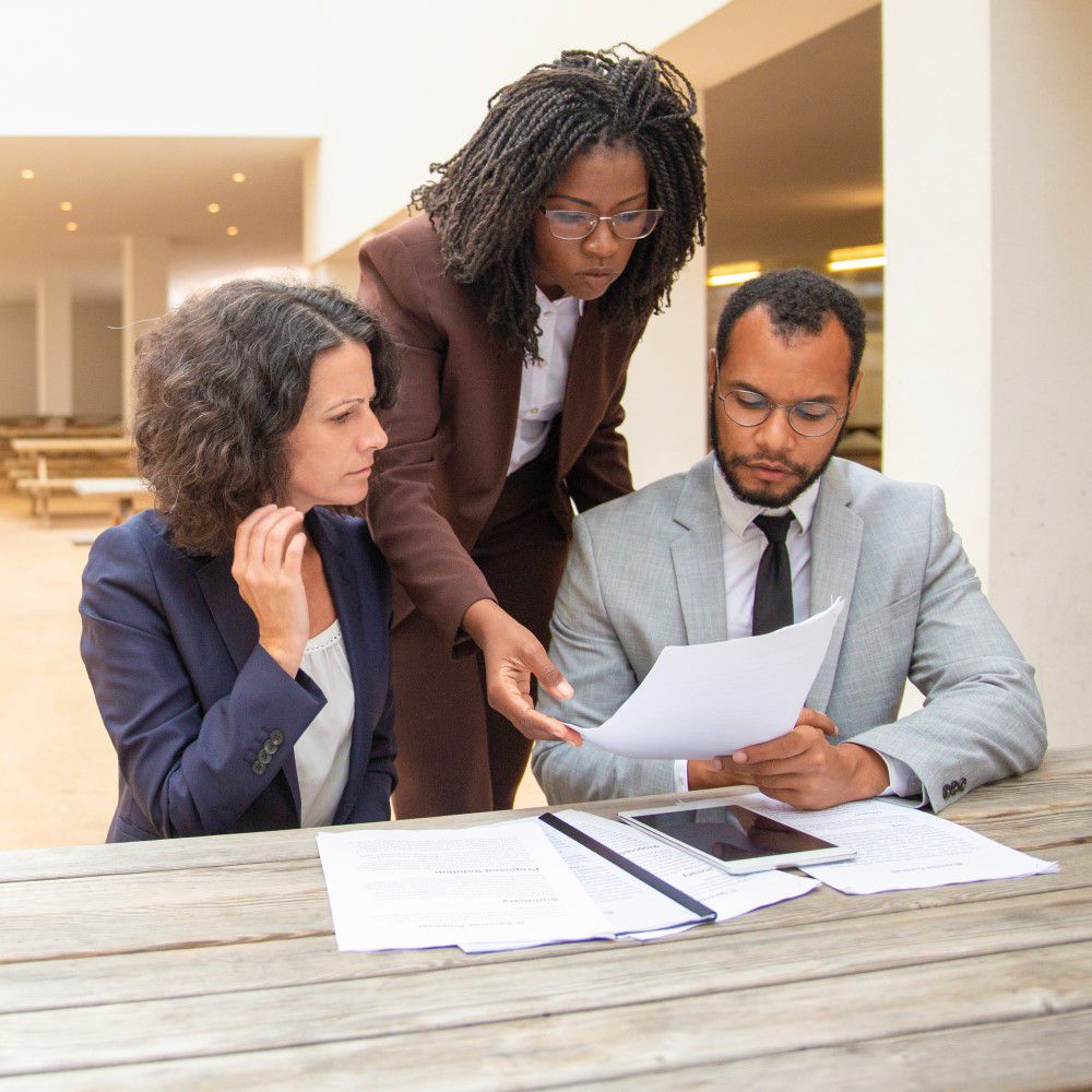 group of three person analysing